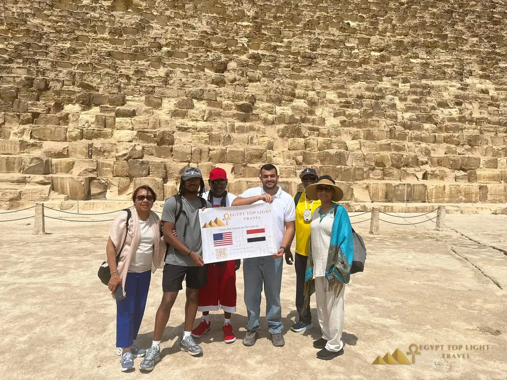Guests holding our welcome banner at the Great Pyramid