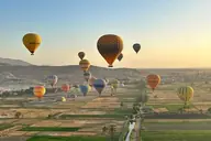 Hot air balloons over Luxor at sunrise